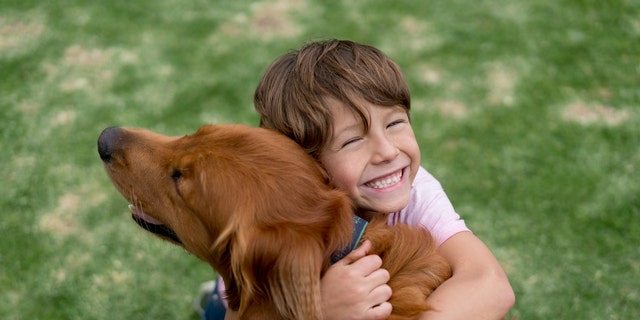 New report claims that kids who grow up with dogs are better behaved ...