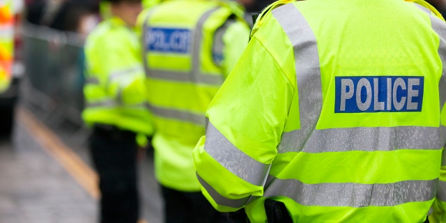 File photo shows British police wearing high-visibility jackets.
