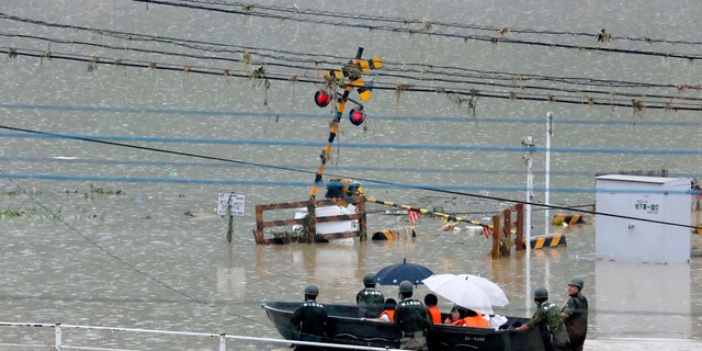 Heavy rain in the Kumamoto region triggered flooding and mudslides Saturday and left dozens still being stranded at their homes and other facilities.