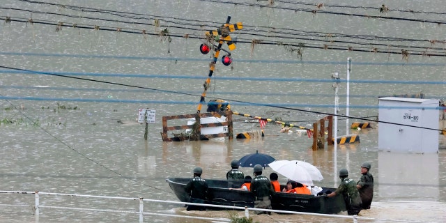Heavy rain in the Kumamoto region triggered flooding and mudslides Saturday and left dozens still being stranded at their homes and other facilities.