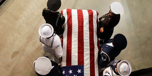 The casket of the late Rep. John Lewis, D-Ga., arrives to lie in repose at Troy University on Saturday, July 25, 2020, in Troy, Ala. (AP Photo/Brynn Anderson)