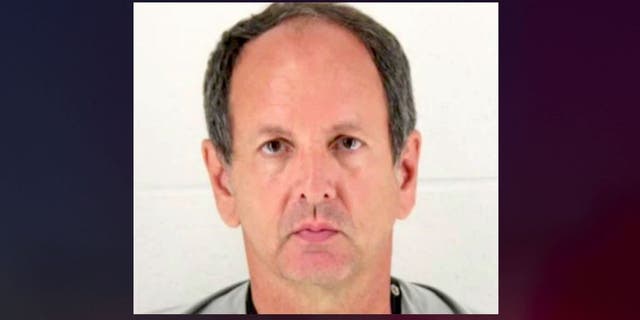 James Loganbill, 58, left his teaching job in March. He now faces a charge of reckless stalking, authorities say. (City of Olathe)