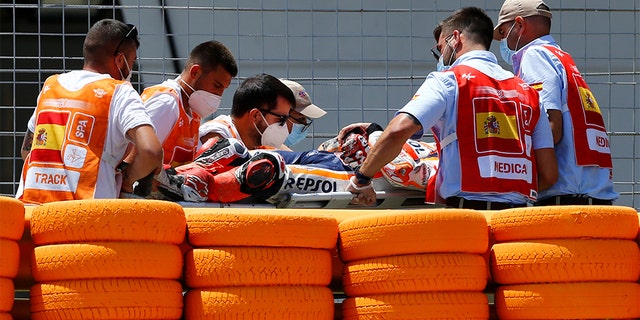 Marquez walked away from the crash, but was taken to the medical center on a stretcher.