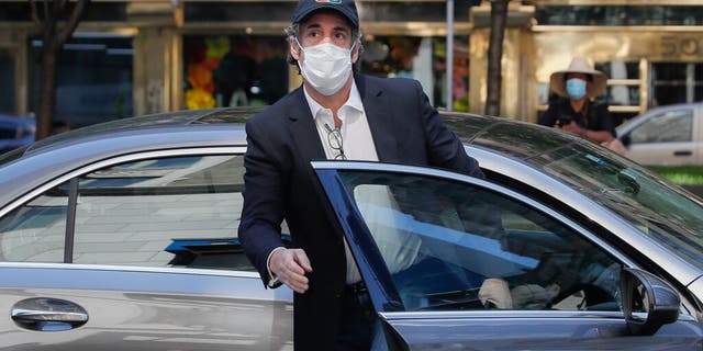 Michael Cohen arrives at his Manhattan apartment, Thursday, May 21, 2020, in New York. 