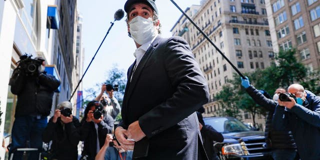 Michael Cohen arrives at his Manhattan apartment, Thursday, May 21, 2020, in New York. President Donald Trump's longtime personal lawyer and fixer was released federal prison Thursday and is expected to serve the remainder of his sentence at home. Cohen has been serving a federal prison sentence at FCI Otisville in New York after pleading guilty to numerous charges, including campaign finance fraud and lying to Congress. (AP Photo/John Minchillo)