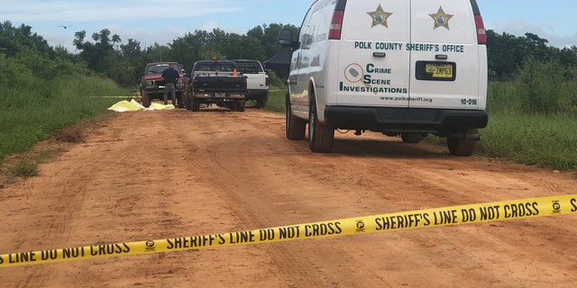 Crime scene tape shows spot where three close friends were killed in Polk County in Florida on Friday night.