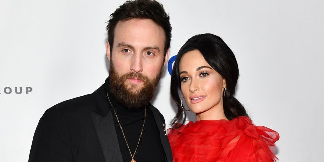 Kacey Musgraves (R) and Ruston Kelly attend the Universal Music Group's 2019 After Party To Celebrate The GRAMMYs at ROW DTLA on February 10, 2019 in Los Angeles, Calif.