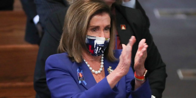 House Speaker Nancy Pelosi applauds during the funeral service for the late Rep. John Lewis, D-Ga., at Ebenezer Baptist Church in Atlanta, Thursday, July 30, 2020. (Alyssa Pointer/Atlanta Journal-Constitution via AP, Pool)