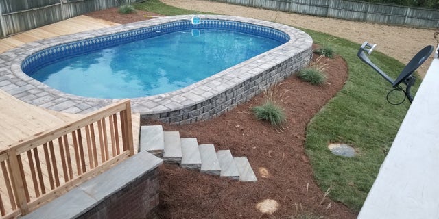 But perhaps the easiest, and most affordable, way to hide the hardware of an above ground pool is through strategically-located landscaping, rocks and lighting.