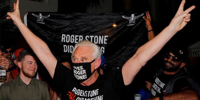 Roger Stone reacts outside his Fort Lauderdale, Florida, home tonight after President Trump commuted his federal prison sentence.