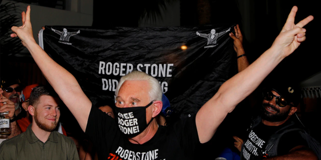 Roger Stone reacts outside his Fort Lauderdale, Florida, home tonight after President Trump commuted his federal prison sentence.