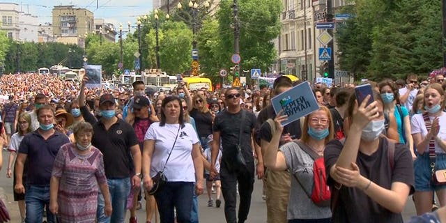 In this video grab taken from the Associated Press Television footage, people attend a protest in support of Sergei Furgal, the governor of the Khabarovsk region, who was arrested in Khabarovsk Thursday and flown to Moscow for interrogation, in Khabarovsk, Russia, Saturday, July 11, 2020. A court in Moscow ruled Friday to jail a provincial governor pending a probe on charges of his involvement in multiple murders. The arrest of Furgal, who has remained widely popular in his region, has stoked broad discontent, with a petition protesting his arrest quickly getting more than 37,000 signatures and residents of Khabarovsk staging pickets in his support.