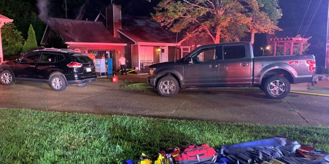 The fire scorched the roof of the attached garage and burned through to the attic, officials said.