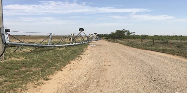 An irrigation system was also toppled by straight-line winds on Tuesday.
