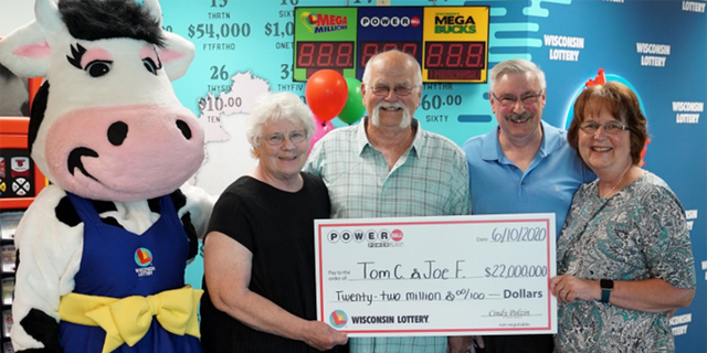 Tim Cook, Joe Feeney and their wives, collecting the prize-winning check