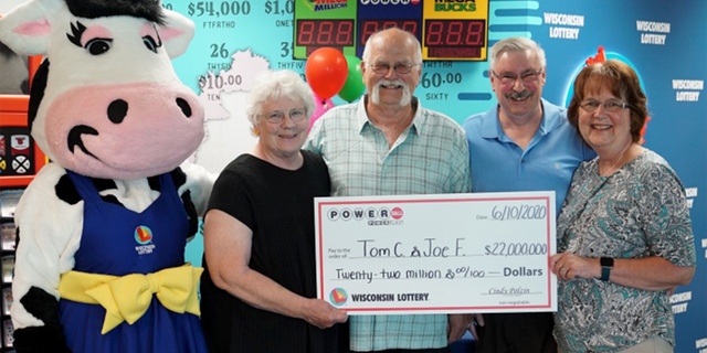Tim Cook, Joe Feeney and their wives, collecting the prize-winning check