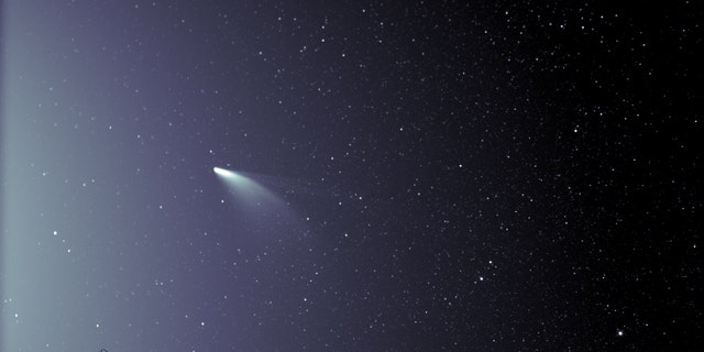 An unprocessed image of the WISPR instrument on board NASA's Parker Solar Probe shows the comet NEOWISE on July 5, 2020, shortly after its closest approach to the sun. The sun is outside the frame on the left. The faint grid pattern near the center of the image is an artifact of the way the image is created. The small black structure in the lower left of the image is caused by a speck of dust that rests on the lens of the imager. (Photo credit: NASA / Johns Hopkins APL / Marine Research Laboratory / Parker Solar Probe / Brendan Gallagher)