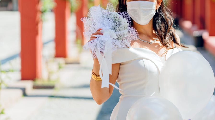 Bride-to-be spends wedding day sewing masks for community