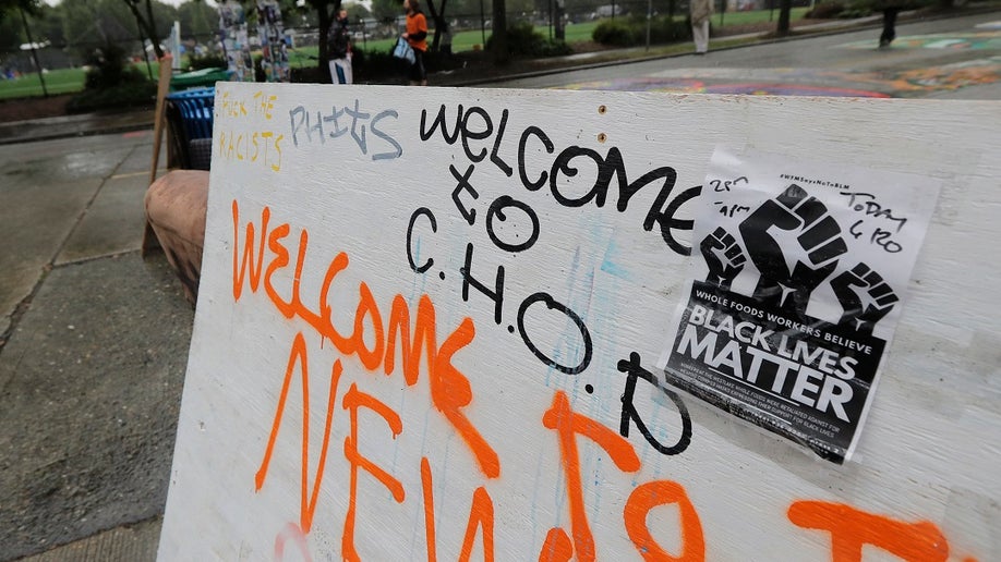 Seattle CHOP zone with sign reading "Welcome to CHOP"