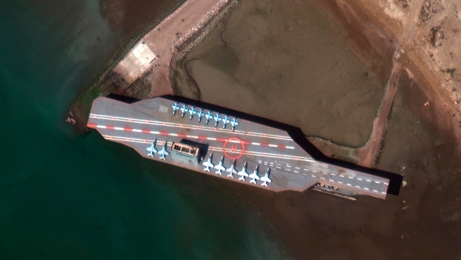 Iran moves mock aircraft carrier into Strait of Hormuz ahead of apparent live-fire drill