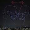 Drones fly over the Han river showing messages to help avoid the spread of the coronavirus in Seoul, South Korea, July 4, 2020.