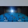 Movie-goers wearing masks to protect themselves from the coronavirus are spaced apart as they watch a movie in a newly reopened cinema in Hangzhou, China, July 20, 2020.