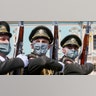 Honor guard soldiers wearing face masks march during a welcome ceremony for Swiss Federal president Simonetta Sommaruga in Kyiv, Ukraine, July 21, 2020.