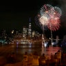 Fireworks explode over lower Manhattan and One World Trade Center on the second of six nights of the Macy's 4th of July fireworks shows in New York City, June 30, 2020.