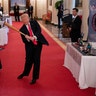 President Donald Trump swings a baseball bat during the Spirit of America Showcase at the White House in Washington, July 2, 2020