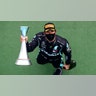 Mercedes driver Lewis Hamilton of Britain holds the trophy after winning the Hungarian Formula One Grand Prix race in Mogyorod, Hungary, July 19, 2020.