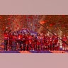 Liverpool players celebrate with the English Premier League trophy after it was presented following the Premier League soccer match between Liverpool and Chelsea in Liverpool, England, July 22, 2020.