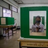 A student sits at her partitioned desk in a classroom at the Samkhok School in Pathum Thani, Thailand, July 1, 2020. 