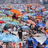 Revelers enjoy the beach at Coney Island in New York City, July 4, 2020.