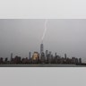 A bolt of lightning strikes One World Trade Center in lower Manhattan during a thunderstorm in New York City, July 22, 2020.