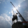 Work crews work to remove the statue of confederate general Stonewall Jackson in Richmond, Virginia, July 1, 2020. 