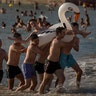 Bathers enjoy the beach in Cadiz, Spain, July 24, 2020. 