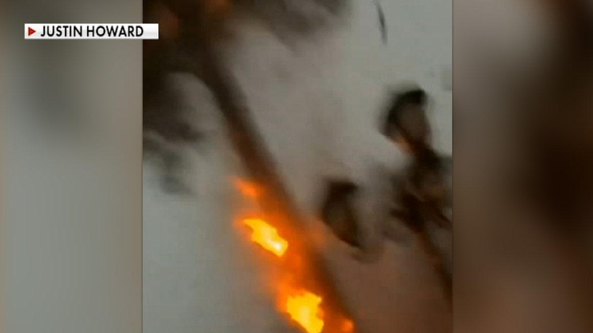 Lightning struck feet away from Justin Howard as it was sitting in the front of his home the Houston area on Wednesday.