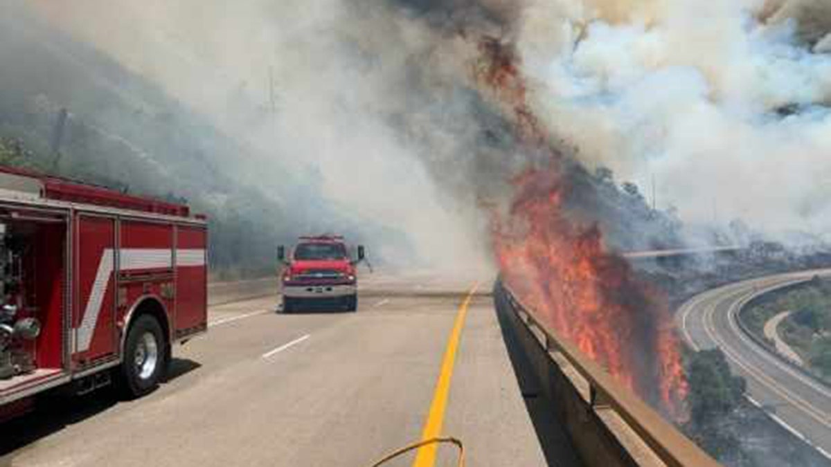 Crews respond to the Grizzly Creek Wildfire burning near Interstate 70 in Colorado on Monday, Aug. 10, 2020.
