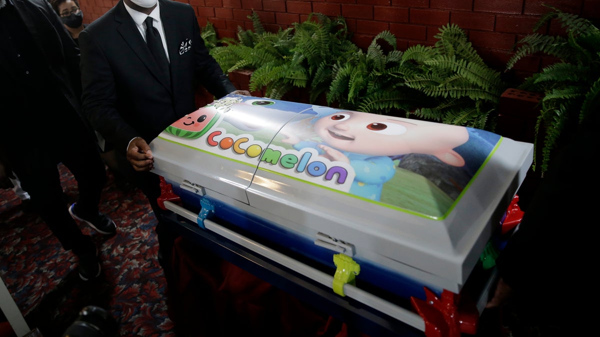 A small casket containing the body of Davell Gardner, Jr. is wheeled out of the church after his funeral service in the Brooklyn borough of New York, on July 27. Authorities are investigating the July 12 shooting that left the 1-year-old boy dead and injured three adults. (AP)