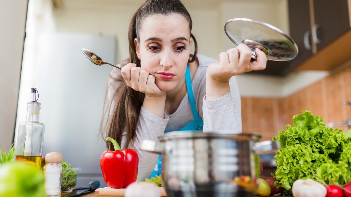 woman in kitchen with food