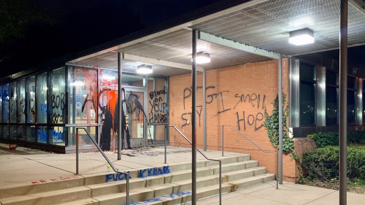 Police officials said protesters vandalized the 5th Precinct exterior with spray-paint and threw large rocks at the building.