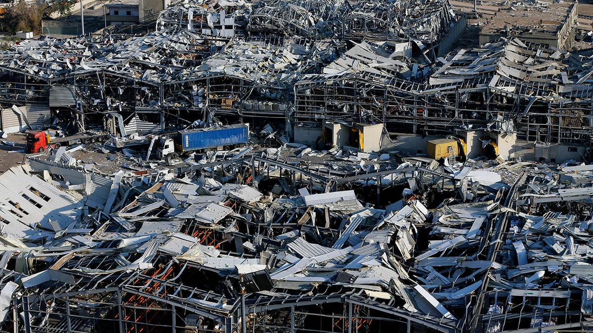 A general view of the scene of an explosion that hit the seaport of Beirut, Lebanon, Wednesday, Aug. 5, 2020. (AP Photo/Bilal Hussein)