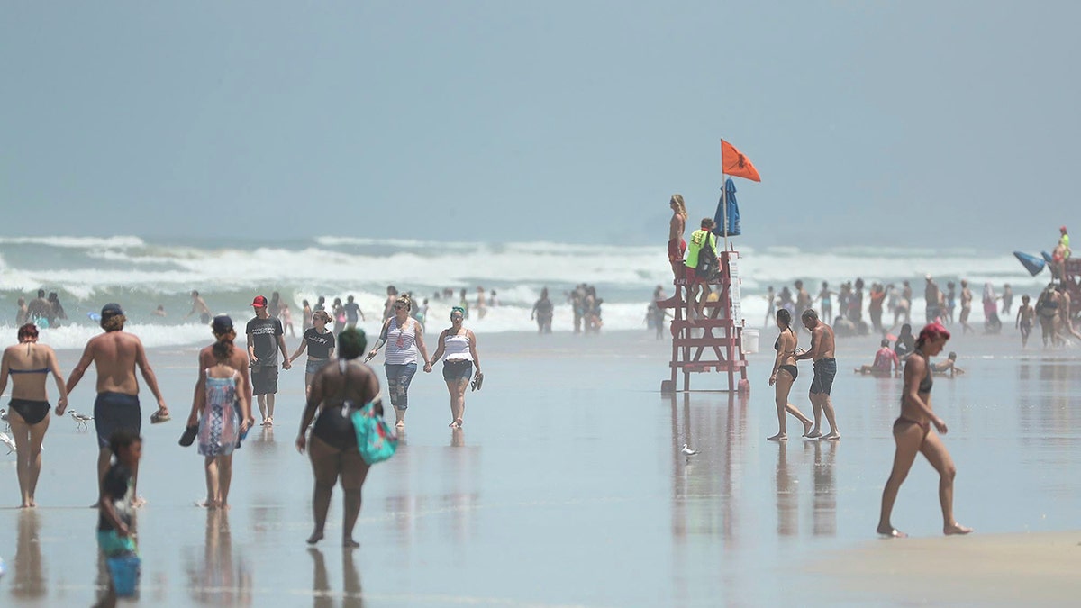 Daytona Beach, Fla., crowded with beachgoers Saturday, Aug. 1, 2020. (Stephen M. Dowell/Orlando Sentinel via AP)
