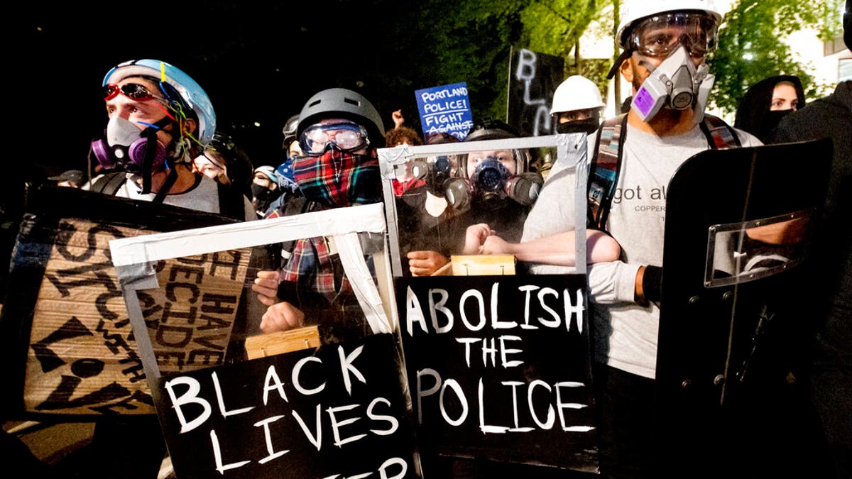 Black Lives Matter protesters march through Portland, Ore. after rallying at the Mark O. Hatfield United States Courthouse on Sunday, Aug. 2, 2020. (Associated Press)