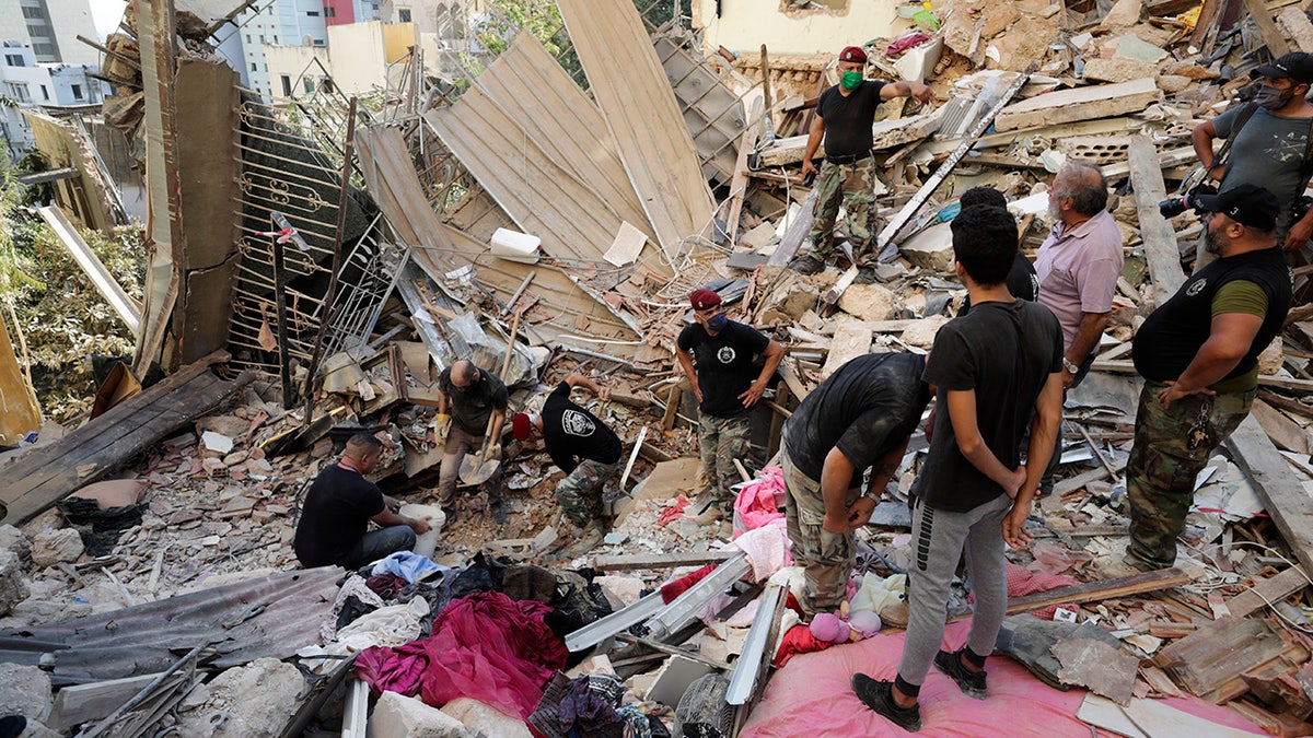 Lebanese soldiers search for survivors after a massive explosion in Beirut, Lebanon, Wednesday, Aug. 5, 2020. (AP Photo/Hassan Ammar)