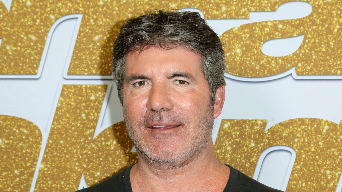 Aug. 28, 2018: Simon Cowell arrives at the "America's Got Talent" Season 13 Week 3 red carpet at the Dolby Theatre in Los Angeles. Cowell broke his back Saturday while testing his new electric bicycle at his home in California. 