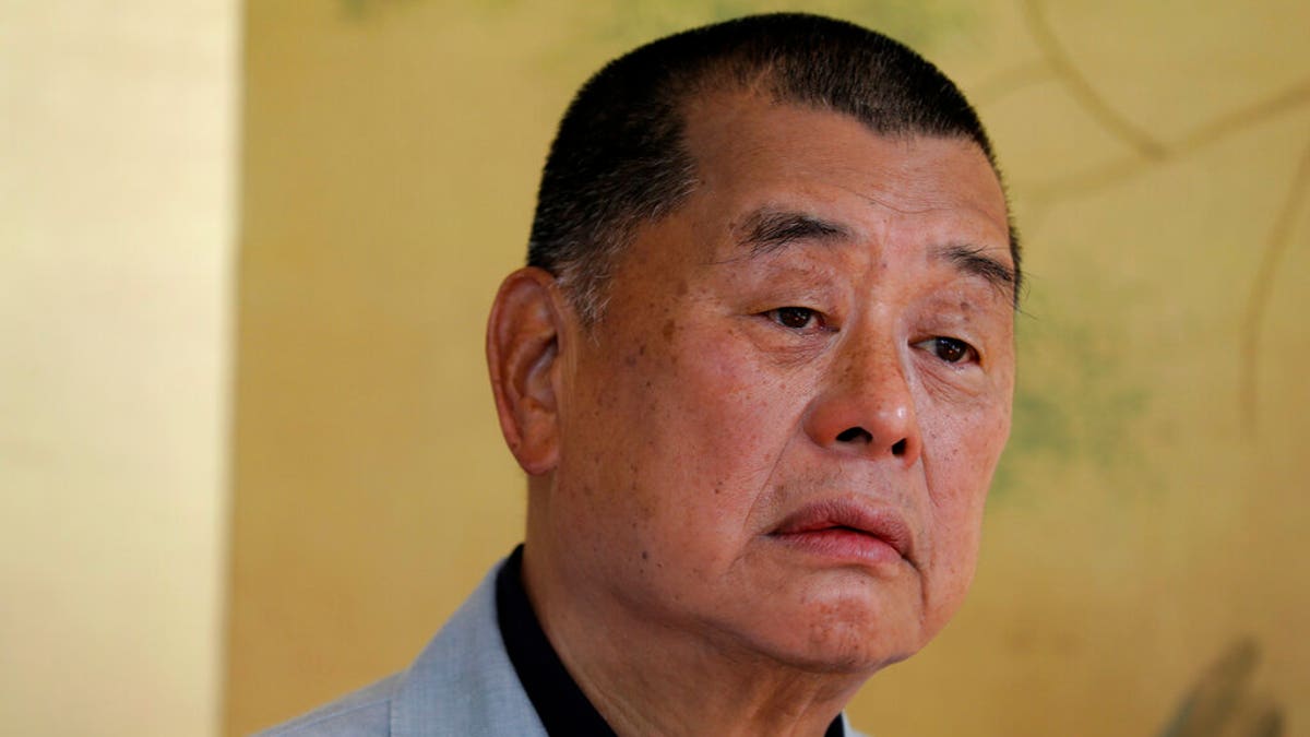 FILE: Hong Kong media tycoon Jimmy Lai pauses during an interview in Hong Kong. 
