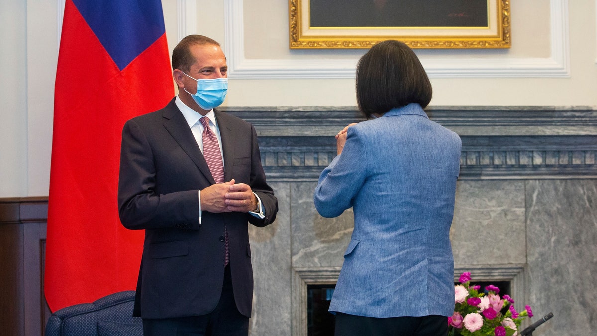 Azar, left, is greeted by Taiwan's President Tsai Ing-wen, right, during a meeting in Taipei, Monday, Aug. 10, 2020. (Pool Photo via AP Photo)