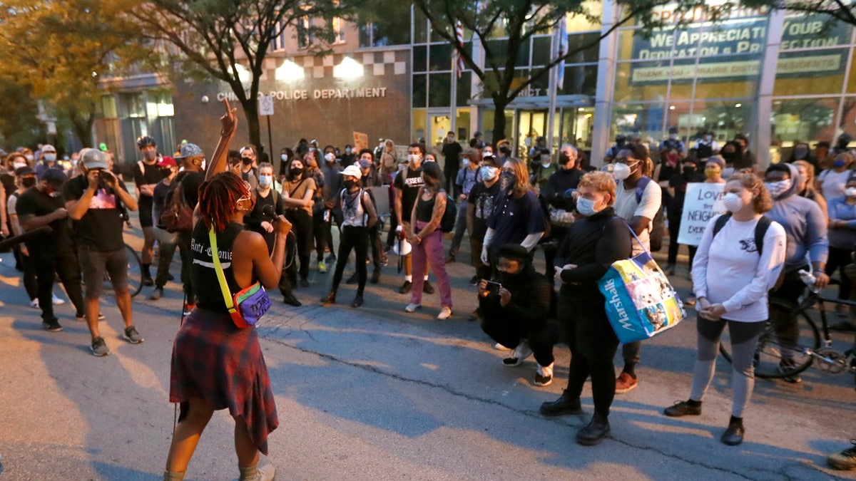 Ariel Atkins, a lead organizer for Black Lives Matter Chicago, leads a protest Aug. 10, outside the Chicago Police Department's District 1 station in Chicago. (AP Photo/Charles Rex Arbogast)