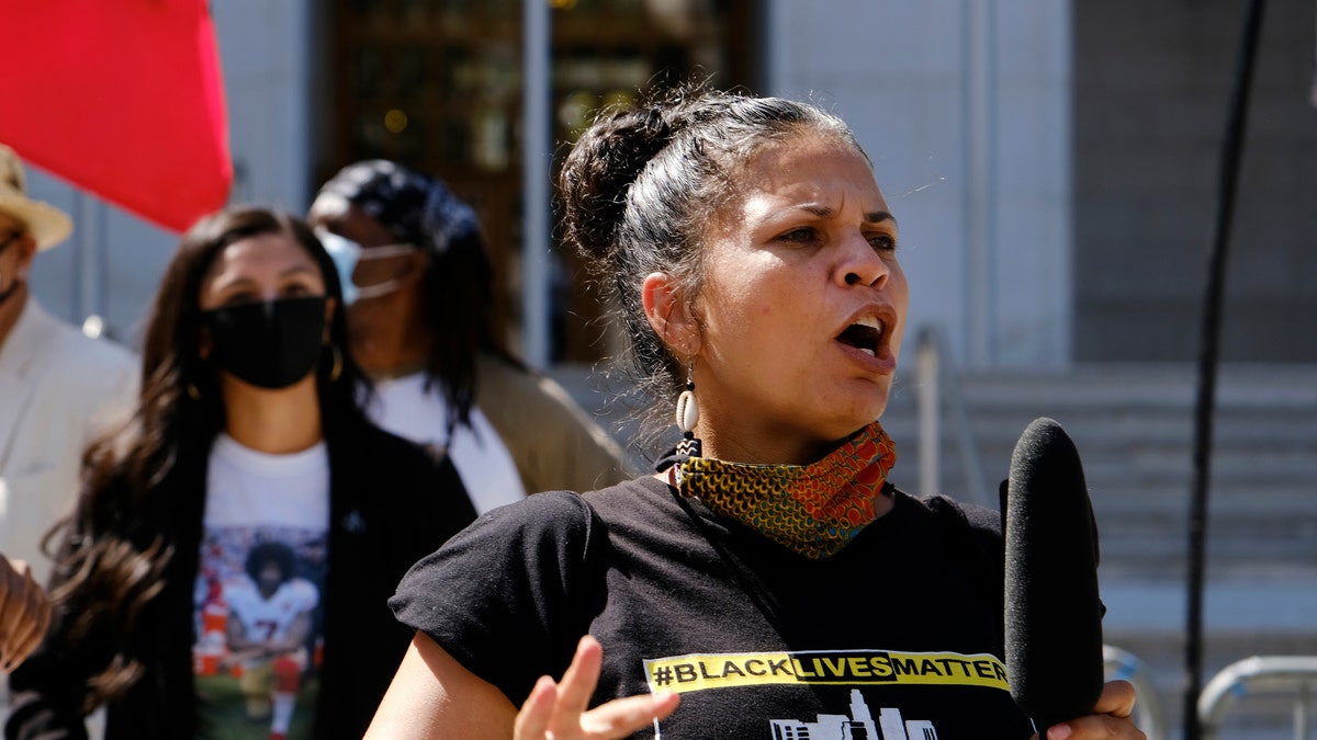 In this Aug. 5, 2020, file photo, Melina Abdullah speaks during a Black Lives Matter protest at the Hall of Justice in downtown Los Angeles. (AP Photo/Richard Vogel, File)